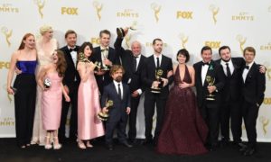 (FILES): This file photo taken on September 20, 2015 shows winners of the award for Outstanding Drama Series for 'Game of Thrones' as they pose in the Press Room during the 67th Emmy Awards in Los Angeles, California. From left are: actors Sophie Turner, Gwendoline Christie, Maisie Williams, Nikolaj Coster-Waldau, Carice van Houten, writer/director David Benioff, actors Peter Dinklage, Conleth Hill, writer/director D.B. Weiss, actress Lena Headey, director David Nutter, actors John Bradley and Alfie Allen. Hollywood begins the long run-up to its annual prizegiving season July 14, 2016 as the television industry finds out who made the cut at the announcement of the 2016 Emmy Awards nominations. HBO's fantasy epic "Game of Thrones" is expected to dominate the nods after raking in a record-breaking 12 awards last year, including best drama series. / AFP PHOTO / VALERIE MACON